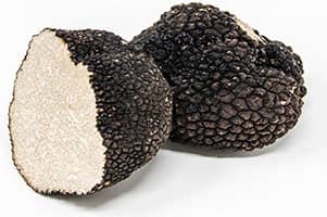 the summer truffle and its beige to brown flesh, streaked with ivory veins